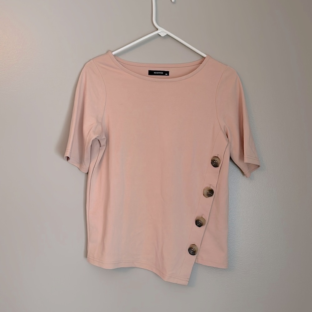Reserved button detail top